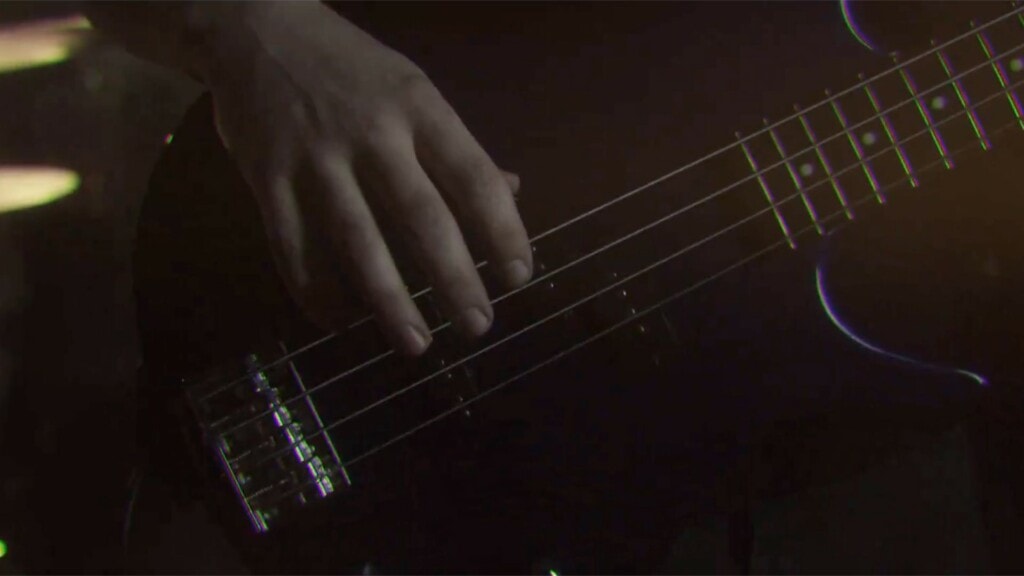 Close up on bass player's hand