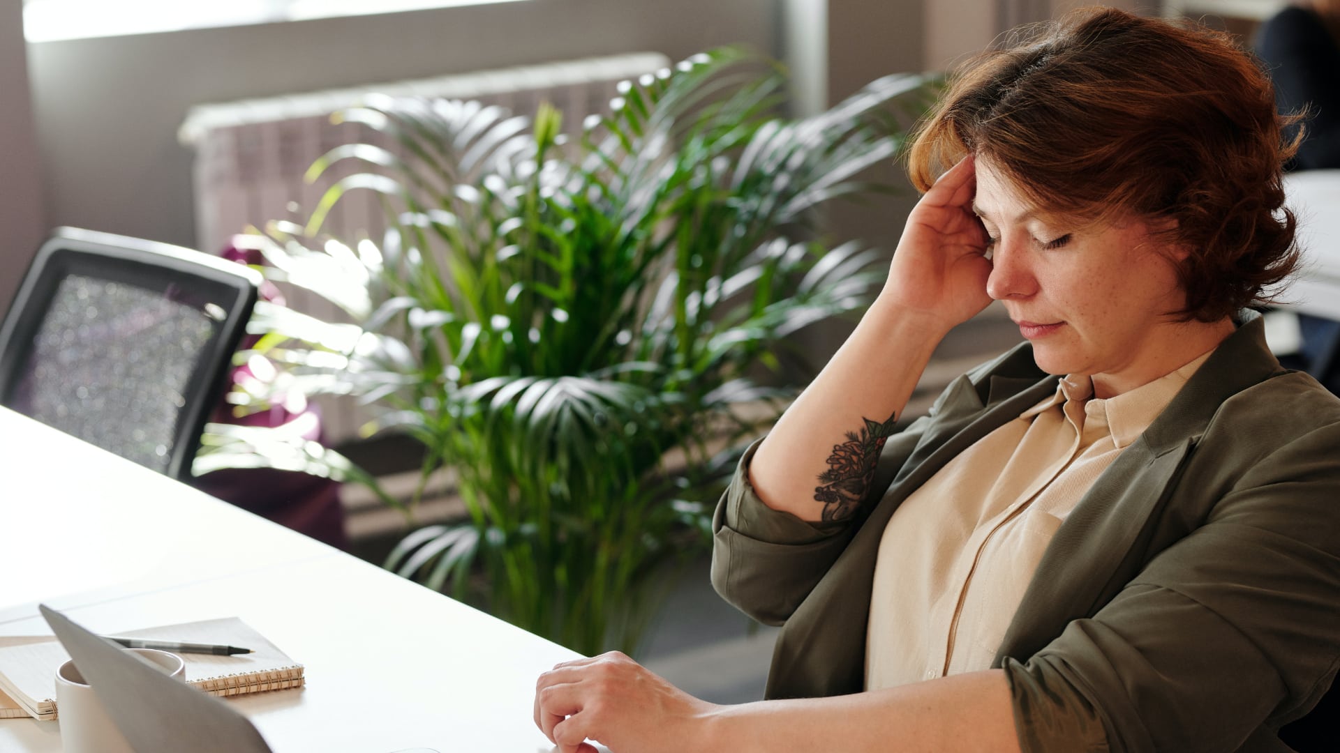 woman thinking about quitting her job