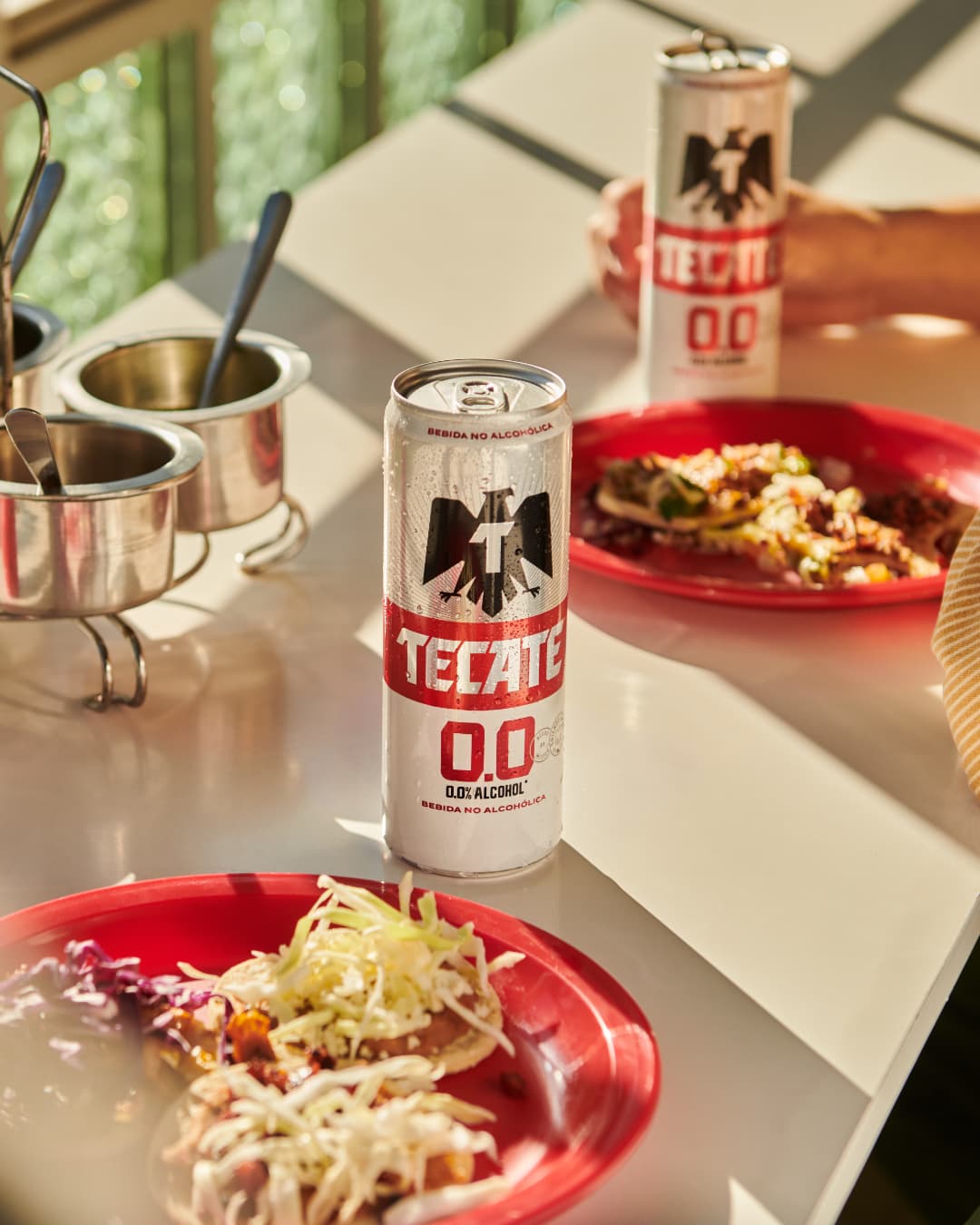 Tecate 00 
 beer can and tacos