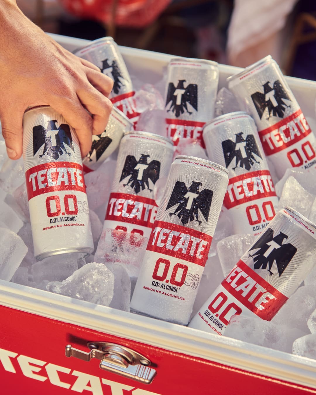 Tecate 00 beer can in a cooler